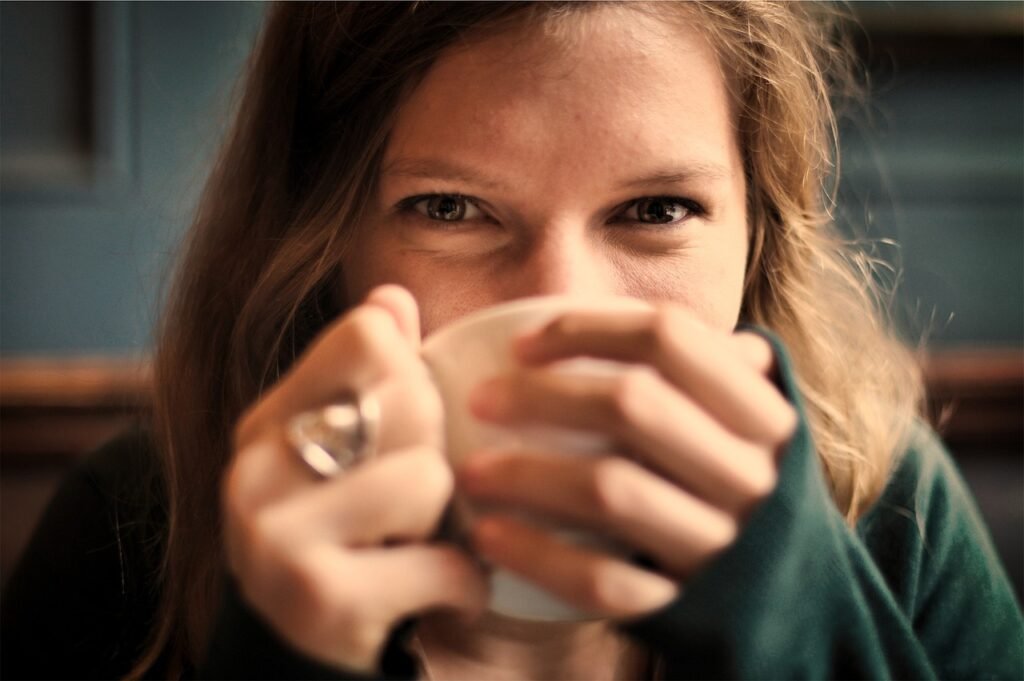 girl, woman, smile, smiling, tea cup, happy, coffee, tea, cup, drinking, eyes, coffee cup, people, cozy, comfortable, relaxed, sipping, brown coffee, brown happy, brown relax, brown tea, brown smile, brown eye, brown happiness, brown cup