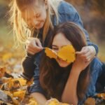 girls, leaves, autumn, game, joy, smile, happiness, evening, nature